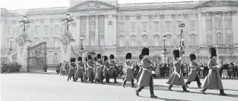  ??  ?? Members of the Coldstream Guards march from Buckingham Palace during a changing of the guard ceremony in London. England is a pop-culture darling this year.