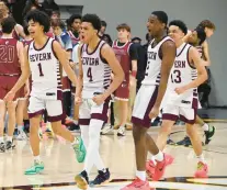  ?? HAIRSTON/STAFF
KIM ?? Severn players, from left, Daniel Growney, Kingston Price, Jacob Randall and Corey Dixon celebrate after beating Gerstell, 62-46, in the MIAA B Conference title game Saturday night at UMBC’s Chesapeake Arena.