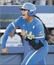  ?? Alonzo Adams Associated Press ?? MEGAN FARAIMO is fired up after her sixth-inning home run helped swing momentum for UCLA.