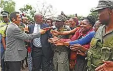  ?? AFP ?? ■ Botswana President Seretse Ian Khama ( left) greets supporters as he leaves after a rally in his village Serowe on March 27 before officially stepping down on Saturday.