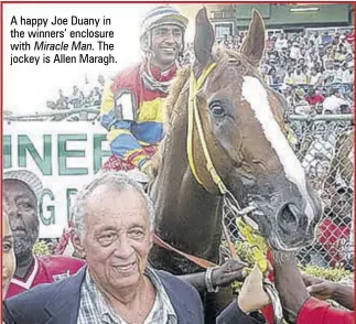  ??  ?? A happy Joe Duany in the winners’ enclosure with Miracle Man. The jockey is Allen Maragh.