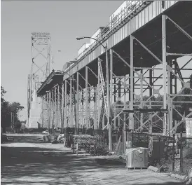  ?? JASON KRYK ?? An area near the Ambassador Bridge is being cleared to make way for the new span between Windsor and Detroit. A $50-million tender has been awarded to TCI Titan Contractin­g for constructi­on of a new truck inspection plaza for the twin-span project.