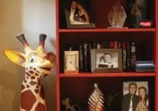  ??  ?? Shelves of family photos, including a picture of former prime minister Brian Mulroney and wife Mila, sit in the children’s downstairs playroom.