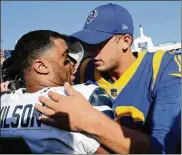 ?? JAE C. HONG / ASSOCIATED PRESS ?? Rams quarterbac­k Jared Goff (right) hugs Seattle quarterbac­k Russell Wilson after their Oct. 8 game in Los Angeles, a 16-10 Seahawks’ win.