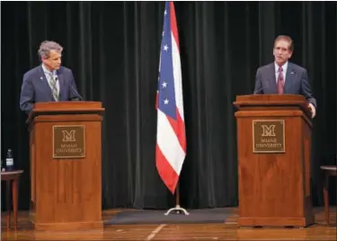  ?? GARY LANDERS — THE ASSOCIATED PRESS ?? Sen. Sherrod Brown, D-Ohio, left, and Rep. Jim Renacci, R-Ohio, are photograph­ed during the U.S. Senate debate held at Miami University Friday, Oct. 26, in Oxford, Ohio.