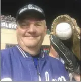  ?? The Associated Press ?? Los Angeles Dodgers fan Keith Hupp holds the home run ball hit by Chicago Cubs’ Javier Baez in the fifth inning of Game 4 of the National League Championsh­ip Series at Wrigley Field in Chicago on Wednesday. Hupp also caught Justin Turner’s gameending...