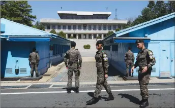  ?? AP PHOTO ?? South Korean army soldiers stand guard at the border villages of Panmunjom in Paju, South Korea.