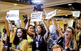  ?? MATT SLOCUM/AP ?? Protesters yell Monday as DNC Chair Debbie Wasserman Schultz arrives for a Philly event.