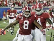  ?? JOHN RAOUX — THE ASSOCIATED PRESS FILE ?? Josh Jacobs (8) celebrates his 77-yard touchdown run against Louisville with teammates including wide receiver Jerry Jeudy (4).