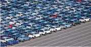  ?? (AFP) ?? Cars bound for shipment are seen parked at Kawasaki Port, in Kawasaki on May 18, 2022