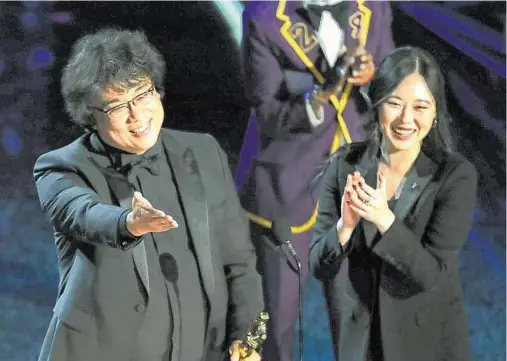  ?? Noel West / New York Times ?? Translator and filmmaker Sharon Choi has been at the side of Bong Joon Ho, left, giving the English translatio­n of the director’s many speeches and interviews during the awards season.