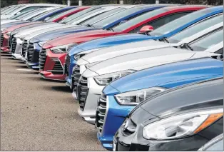  ?? AP PHOTO ?? In this Oct. 6, 2017, photo, a line of 2018 Accents, Elantras and Sonatas sits at a Hyundai dealership in the south Denver suburb of Littleton, Colo.