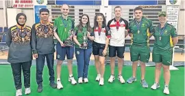  ?? ?? Irish eyes were smiling Ireland’s Shauna O’Neill and Ryan McElroy (second pair from left) won the mixed pairs at the under-25 World Championsh­ips in EK