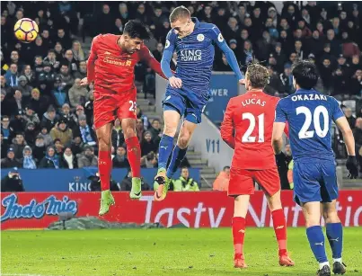  ?? Getty. ?? Jamie Vardy gets above Liverpool’s Emre Can to head in his second, and Leicester’s third, goal.