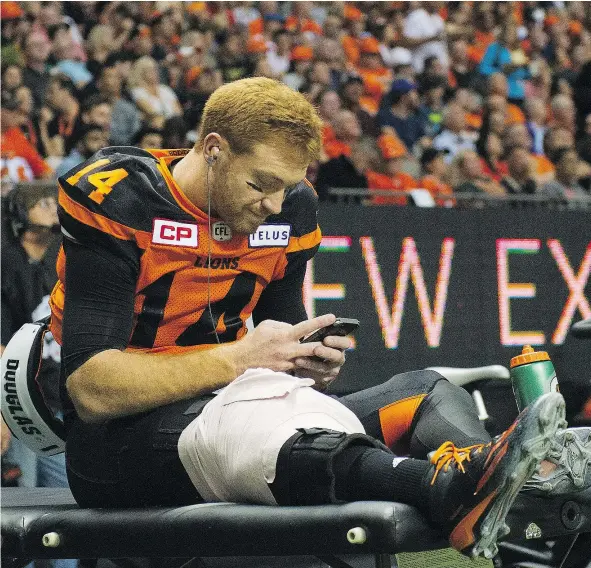  ?? GERRY KAHRMANN/PNG FILES ?? Travis Lulay was parked on the bench with an ice pack on his right knee after being injured on the second play of Friday night’s win over the Montreal Alouettes. The 33-year-old QB will undergo surgery at the end of the month to repair a torn ACL.