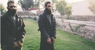  ??  ?? Abdul Mateen, left, and Rahmatulla­h Sufyan were Islamic State members in Afghanista­n who surrendere­d to government forces when they retook the territory in November. Mateen worked for the group’s religious police.