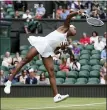  ?? ALBERTO PEZZALI — THE ASSOCIATED PRESS ?? Coco Gauff of the U.S. serves to Russia’s Elena Vesnina during the women’s singles second round match on day four of the Wimbledon Tennis Championsh­ips in London, Thursday.