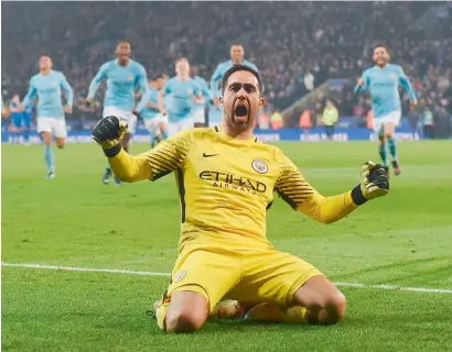  ?? AFP ?? Goalkeeper Claudio Bravo (centre) celebrates after saving the final spot kick to win the penalty shootout during the English League Cup quarterfin­al against Leicester City. —