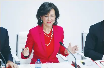  ?? (Juan Medina/Reuters) ?? SANTANDER CHAIRWOMAN Ana Botin gestures during a news conference in Madrid yesterday. Santander announced it will buy struggling rival Banco Popular for a nominal €1 after European authoritie­s determined the lender was on the verge of insolvency.