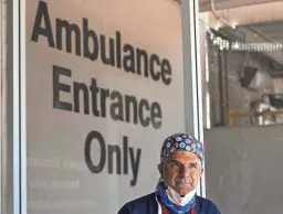  ??  ?? Dr. Frank LoVecchio stands outside the ER at Valleywise Medical Center in Phoenix on June 20.