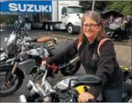  ??  ?? Marie Doucette of Maine took several motorcycle test rides at Americade on Tuesday.