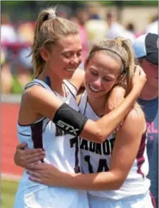  ?? PETE BANNAN — DIGITAL FIRST MEDIA ?? Radnor’s Cate Cox, left, and Julianne Puckette embrace in celebratio­n following their PIAA Class 2A girls lacrosse championsh­ip triumph over District 3’s Kennard-Dale at West Chester East High School. They combined for 12 goals in the victory.