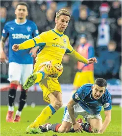  ?? Pictures: SNS. ?? Top: Blair Alston makes it 1-1. Above: Chris Millar is hoping his performanc­e against Rangers can result in a prolonged run in the team.