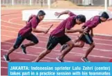  ?? — AFP ?? JAKARTA: Indonesian sprinter Lalu Zohri (center) takes part in a practice session with his teammates at the Senayan sport complex in Jakarta, ahead of the 2018 Asian Games.