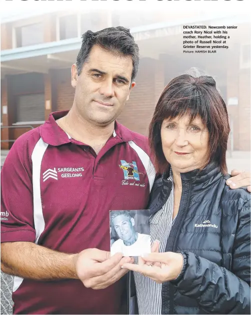  ?? Picture: HAMISH BLAIR ?? DEVASTATED: Newcomb senior coach Rory Nicol with his mother, Heather, holding a photo of Russell Nicol at Grinter Reserve yesterday.