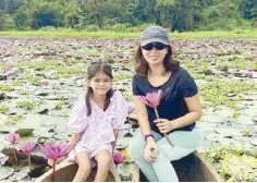  ?? ?? Monica and Cosima picking beautiful lotus flowers at dawn