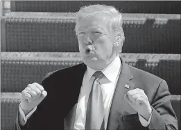  ?? [TERRY RENNA/THE ASSOCIATED PRESS] ?? President Donald Trump gestures to the crowd from the steps of Air Force One during his arrival Friday in West Palm Beach, Fla. Special counsel Robert Mueller’s report does not recommend any further indictment­s, a source said, which is good news for the handful of Trump associates and family members dogged by speculatio­n of possible wrongdoing.