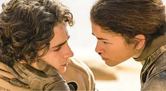  ?? WARNER BROS. ?? Timothée Chalamet, left, and Zendaya play lovers and fighters in the sci-fi movie “Dune: Part Two.”