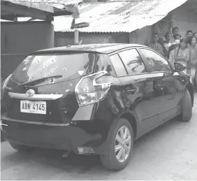  ?? PHOTOS COURTESY OF TABUELAN POLICE STATION ?? The vehicle of Police Officer 1 Avita Sarzuelo was peppered with bullets in an ambush in Tabuelan town, Cebu. Sarzuelo was dead on the spot.