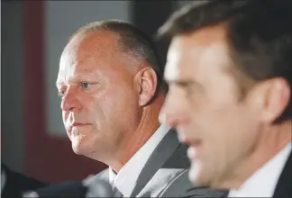  ?? JOHN LOCHER / AP ?? Gerard Gallant, left, listens to Vegas Golden Knights general manager George Mcphee, right, speak during an April 17 news conference where Gallant was introduced as the first coach of the NHL expansion team.