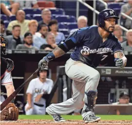  ?? STEVE MITCHELL / USA TODAY SPORTS ?? Brewers rightfield­er Eric Thames connects for a double in the third inning against the Marlins on Wednesday night.