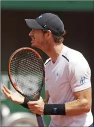  ?? PETR DAVID JOSEK — ASSOCIATED PRESS ?? Britain’s Andy Murray gestures after missing a shot against Russia Karen Khachanov during their fourth round match of the French Open tennis tournament at the Roland Garros stadium, in Paris, France. Monday.