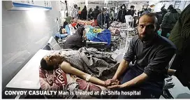  ?? ?? CONVOY CASUALTY
Man is treated at Al-shifa hospital