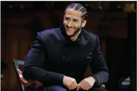  ?? (AP file/Steven Senne) ?? Former NFL quarterbac­k Colin Kaepernick smiles on stage during W.E.B. Du Bois Medal ceremonies at Harvard University, in Cambridge, Mass., in this 2018 photo. Netflix has announced it will air a six-part drama from Kaepernick and Ava DuVernay called “Colin in Black & White.” It will highlight his high school years.