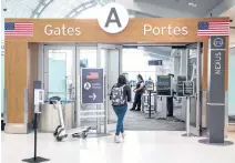  ?? REUTERS ?? A passenger walks towards the gates for U.S. travel at Toronto Pearson Internatio­nal Airport in Toronto on June 23.