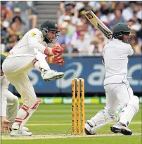  ?? Picture: AFP ?? SLICED: Pakistan batsman Asad Shafiq cuts a delivery Matthew Wade does a one-footed dance in Melbourne as Australia’s