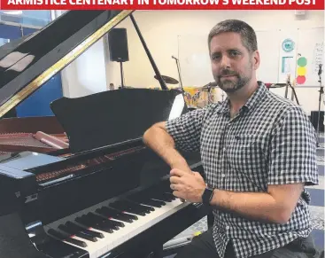  ??  ?? IN TUNE: St Monica's College music teacher Chris Burcin is proud to sing in the Voices of Remembranc­e concert in Cairns to commemorat­e the armistice.