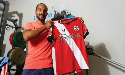  ??  ?? Theo Walcott poses with a Southampto­n shirt after rejoining the club on a season-long loan from Everton. Photograph: Matt Watson/ Southampto­n FC/Getty Images