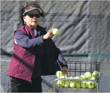  ??  ?? Santa Fe High tennis head coach Bonnie Rogers holds practice Thursday at the school’s tennis courts.