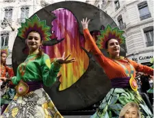  ?? — AFP ?? Dancers perform during a parade on the theme of peace for the 18th edition of the Lyon Dance Biennial on a street in Lyon, France on Sunday.