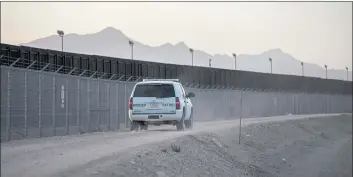  ?? TAMIR KALIFA — THE NEW YORK TIMES ?? A Border Patrol vehicle drives along the U.S.-Mexico fence in El Paso, Texas, in 2019.