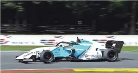  ?? DAVE KALLMANN / MILWAUKEE JOURNAL SENTINEL ?? James Roe Jr. rounds Turn 6 during F3 Americas practice Thursday at Road America.