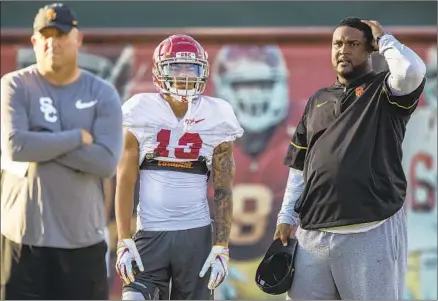  ?? Brian van der Brug Los Angeles Times ?? CLAY HELTON, left, took away play-calling duties from offensive coordinato­r Tee Martin, right, during the season, and the head coach removed Martin from his staff Tuesday, essentiall­y laying the responsibi­lity for the Trojans’ 5-7 record on the offense.