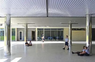  ??  ?? Read from left to right, the eastern elevation progresses from structured to playful through the abstracted forms of the perforated facade.
An undercroft at the southern end of the building provides a sheltered play area and a space for alfresco parent dinners.