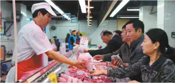  ?? AGENCE FRANCE-PRESSE ?? Le comptoir des viandes d’un supermarch­é de Jiujiang, en Chine