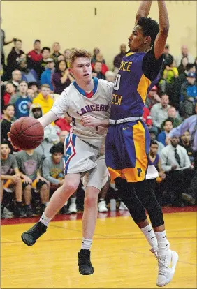  ?? DANA JENSEN/THE DAY ?? Waterford’s Eric Pinch (1) passes the ball around Prince Tech’s Darius Nelson during Wedneday night’s CIAC Division III boys’ basketball tournament semifinal game at North Haven High School. The No. 2 Lancers defeated the No. 3 Falcons 77-68.